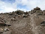 Here we are at 4900m high above sea level. Small stone piles are built by locals to honor the volcano god.