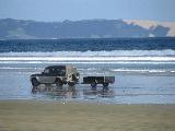 90 mile beach is quite flat, and 4-wheel-drive cars have fun on it