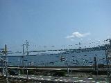 Behind is Akashi-Kaikyo, the longest suspension bridge in the world. It links Hon-shu (Japan's main island) with Shikoku.
