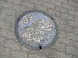 In Japan, sewer outlets are often nicely decorated. This one has Osaka castle on it.