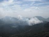 Walking down. The wind has cleared most of the fog, now we can see how much of it was smoke from the volcano