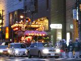 Sorry, the picture isn't good, but this colourful car carries the temple's god (the one that has the festival). It is funny to notice that  because of the depression, they don't stop the traffic (not to disturb businesses) and dancers and God alike have to wait at the traffic lights :p