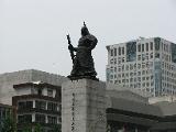 This statue is of national hero General Lee Sunsin, who stopped a Japanese invasion thanks to his leadership and a battleship he designed, the Geobukseon, known as the 
