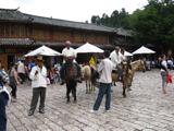 Chinese minority people offer horseback visit of the place, traditional food, and a wide variety of souvenirs